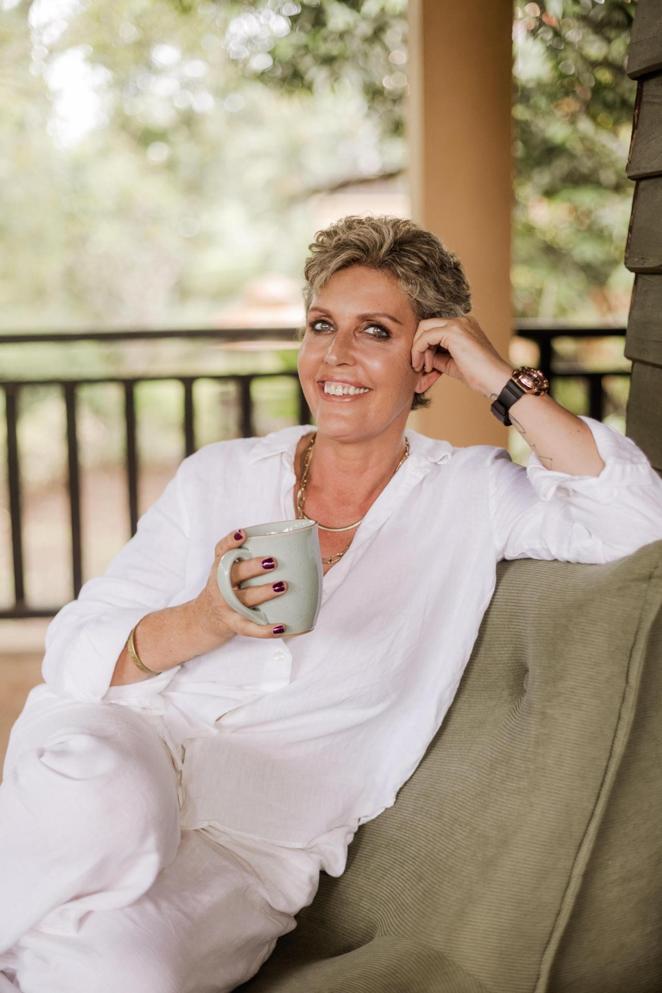 Tania Thomson relaxed on veranda with morning tea